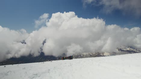 mountain climbers on snowy summit