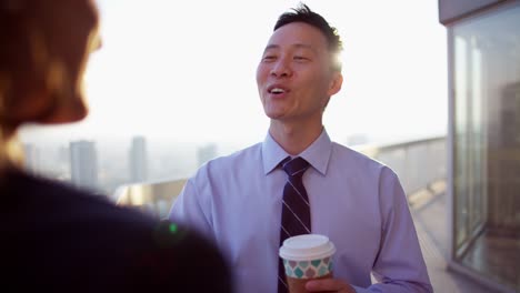 multi ethnic business colleagues coffee break on rooftop