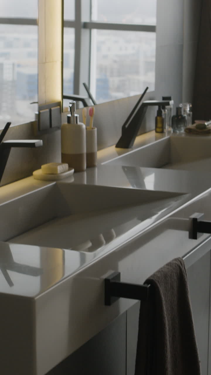 Modern Bathroom with Double Sinks and City View