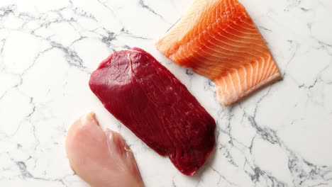 fresh raw beef steak  chicken breast  and salmon fillet