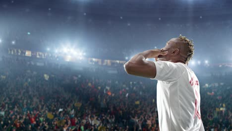 happy soccer player on a football stadium