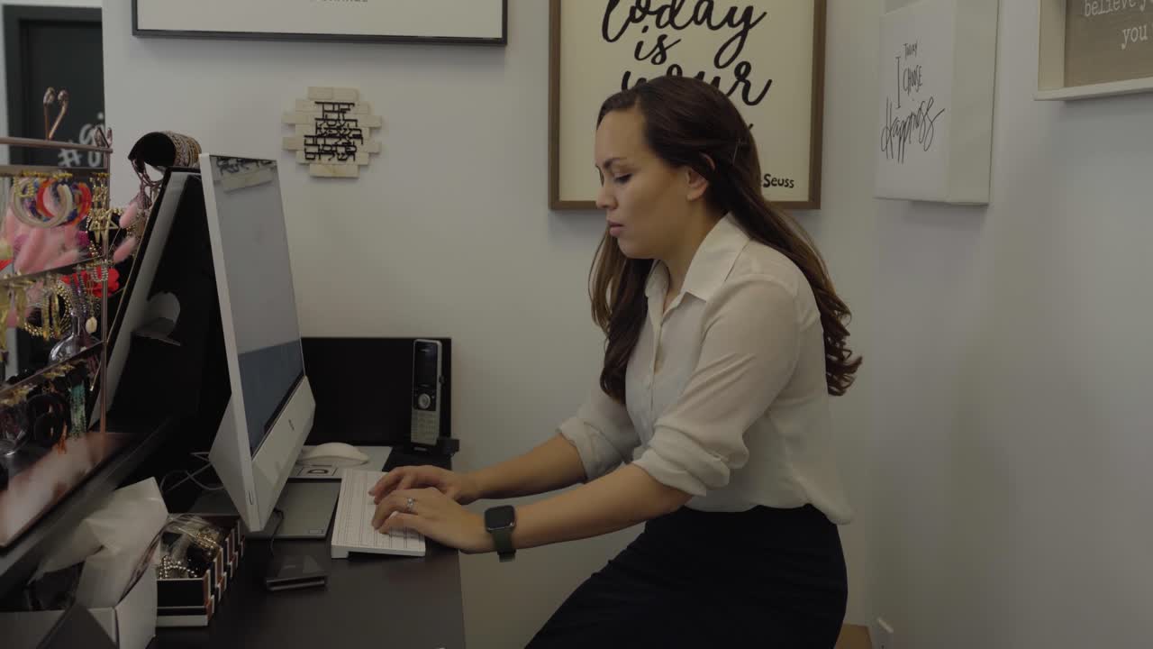Woman using a computer at work