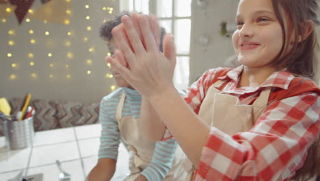 chef and kids kneading dough with stand mixer during cooking masterclass