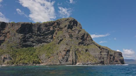 View-from-boat-of-Playa-Fronton-beach-and-promontory,-Las-Galeras-in-Dominican-Republic