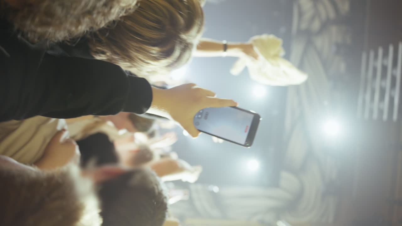 Audience Holding Up Smartphones at a Music Concert