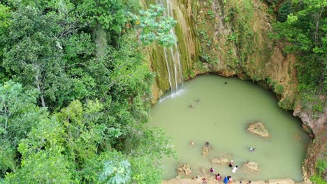 People-Swim-on-The-Natural-Pool-Of-Salto-de-Limon-Waterfall-Amid-Lush-Greenery-In-Samana-Peninsula,-Dominican-Republic