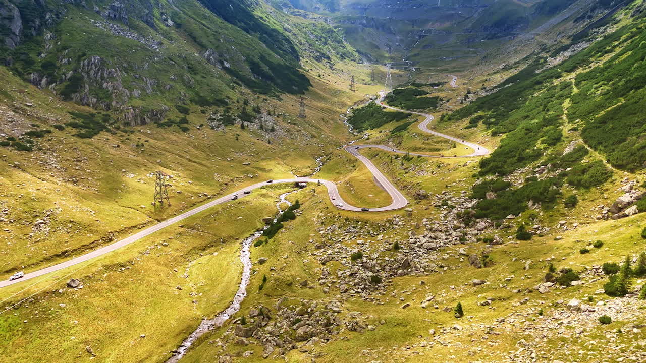 Curving Transfagarasan highway in the Carpathians. Aerial view of the Transfagarasan road making multiple sharp turns through the mountains in Romania