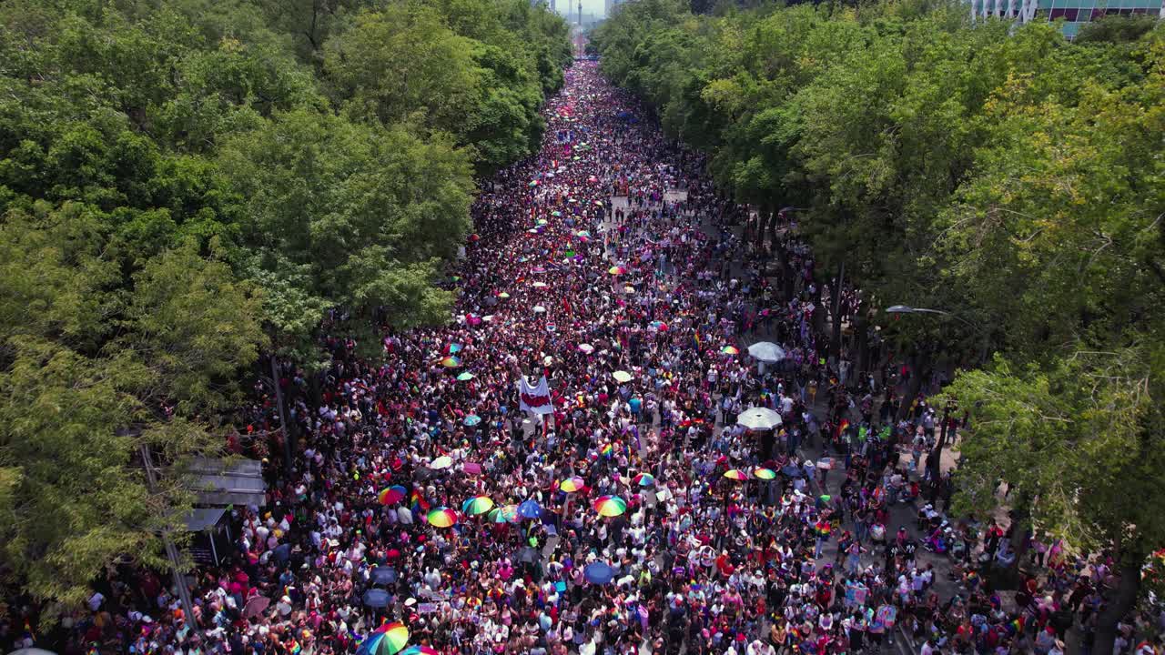 Drone shot over hundreds of people supporting gays, lesbians, friends and family of LGBT community, on the Reforma avenue in Mexico city