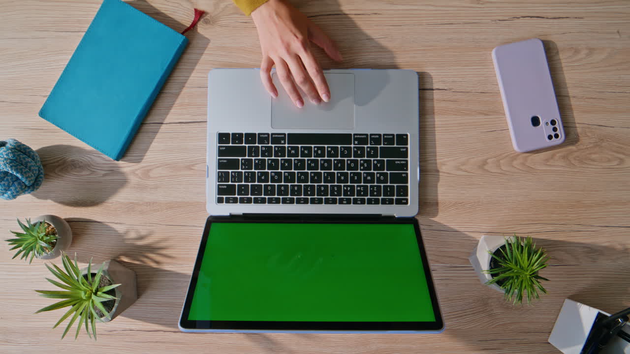 Hand using touchpad mockup laptop in professional workspace closeup top view