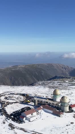 aerial view of a mountaintop radar station in the pyrenees mountains