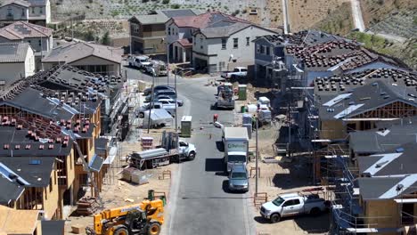 a daytime aerial view of a new housing development under construction in a suburban neighborhood