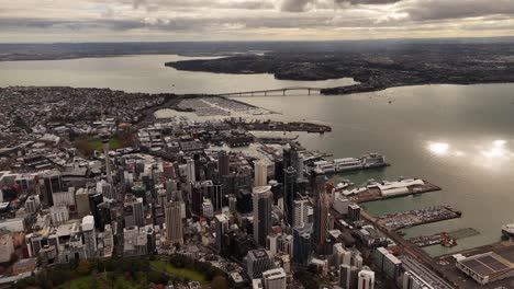 high panoramic aerial view of auckland city, harbour bridge in the background