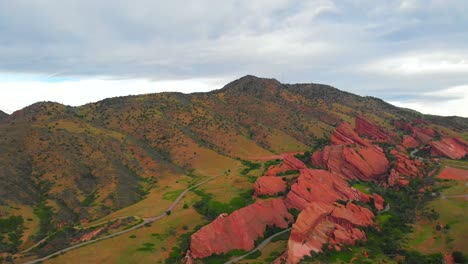 aerial shot rising up above red rocks park and amphitheatre