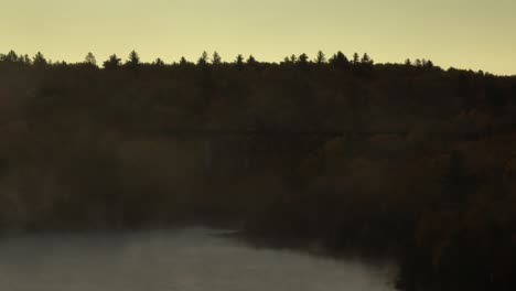 Low-angle-aerial-of-Onawa-Trestle-bridge-view-through-morning-fog