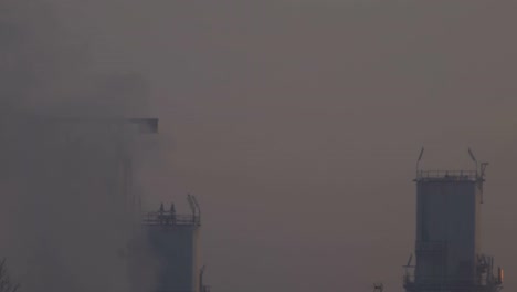 factory emitting smoke and creates pollution in the air