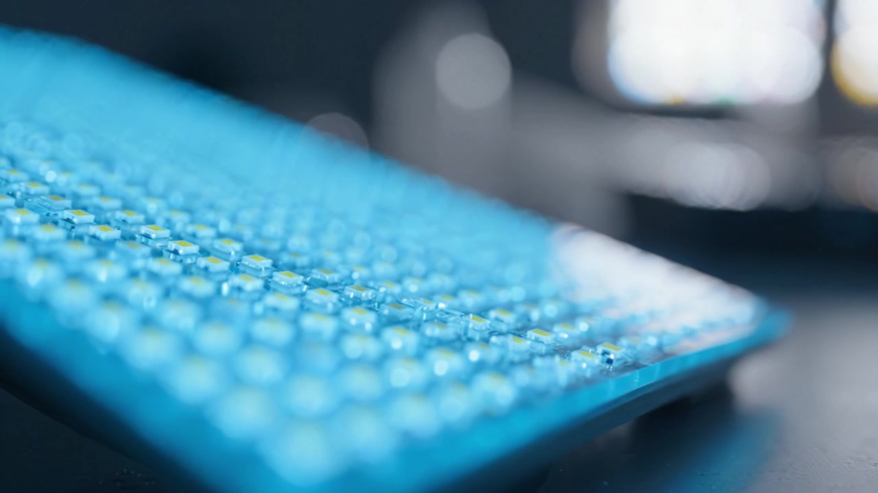 Close-Up of a Blue LED Light Panel with an Abstract Soft Focus Background, Showcasing its Unique Textured Design and Luminous Glow in a Dim Environment