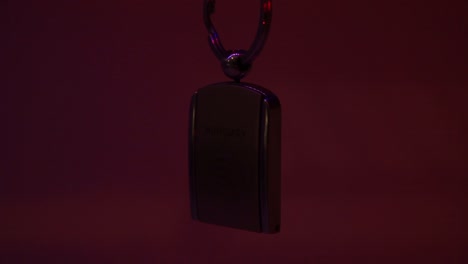 close up of the hungary metal souvenir keychain and the moving laser light