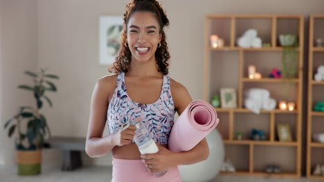 woman with yoga mat and water bottle