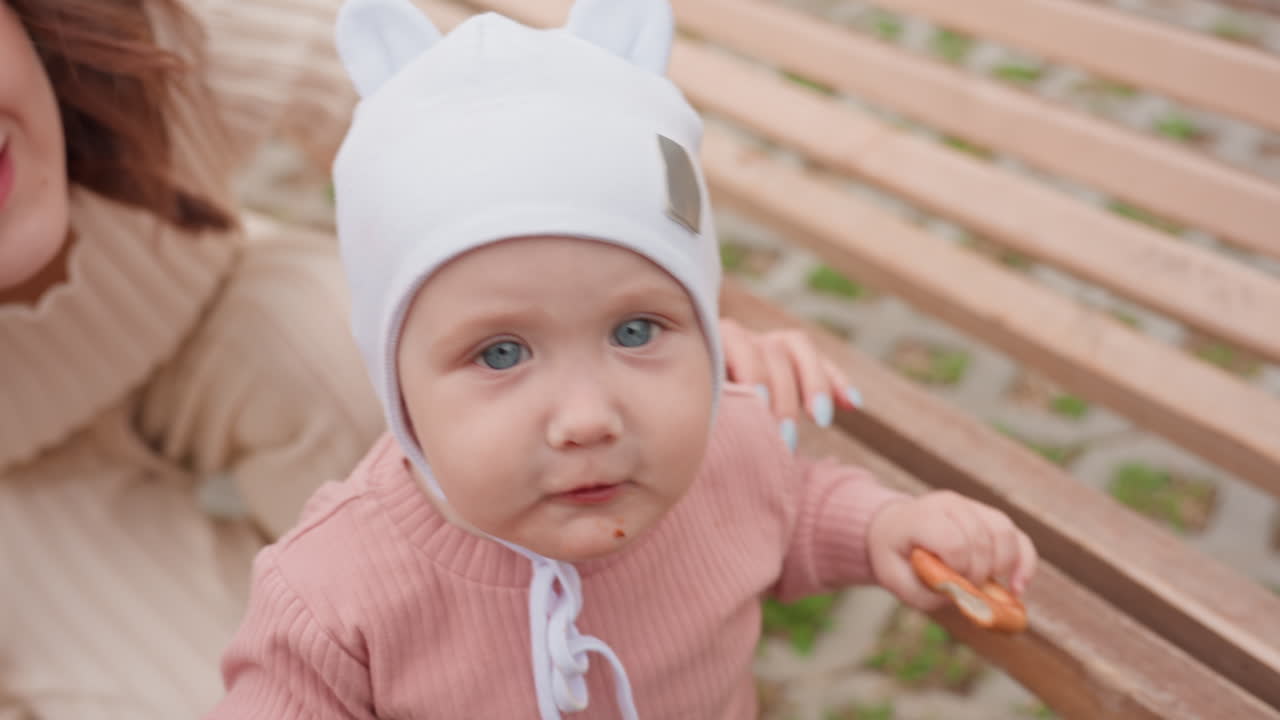 Youngster Relishes Crunchy Treats, Small Child Delights In Crunchy Breadstick With Scattered Crumbs On Table, Young Child Happily Indulges In Crispy Snack Bites While Crumbs Fall All Around Table