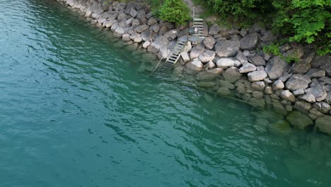 zen meditation relaxation peaceful background of water reaching rocky shore