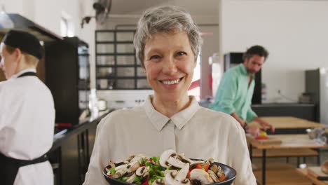 chef showing her dish