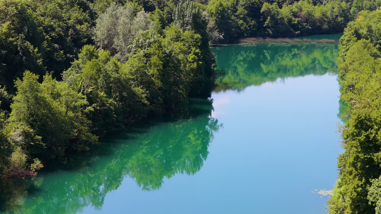 Reflections Over Emerald Green Waters Of Mreznica River In Central Croatia. Aerial Drone Shot