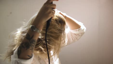 woman drying her hair