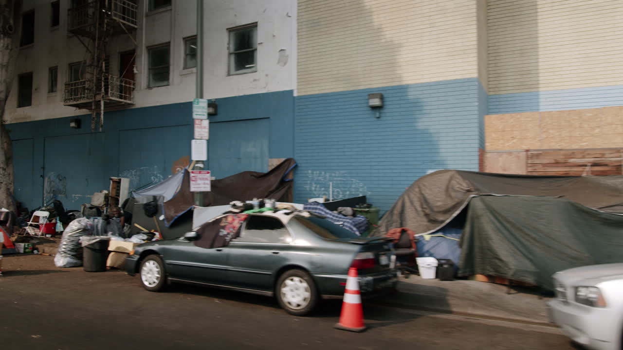 Street scenes depicting homeless encampments in an urban setting