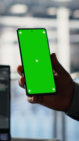 vertical video engineer using isolated screen smartphone in server room while optimizing ai