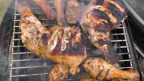 Tasty-chicken-legs-on-the-grill-with-fire-flames