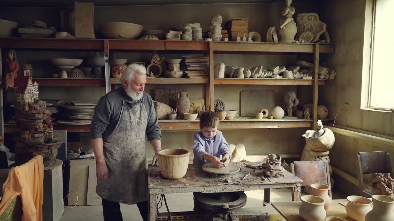 Grandfather and Grandson in a Pottery Studio