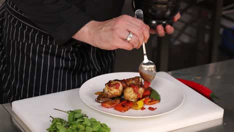 chef preparing roasted chicken with vegetables