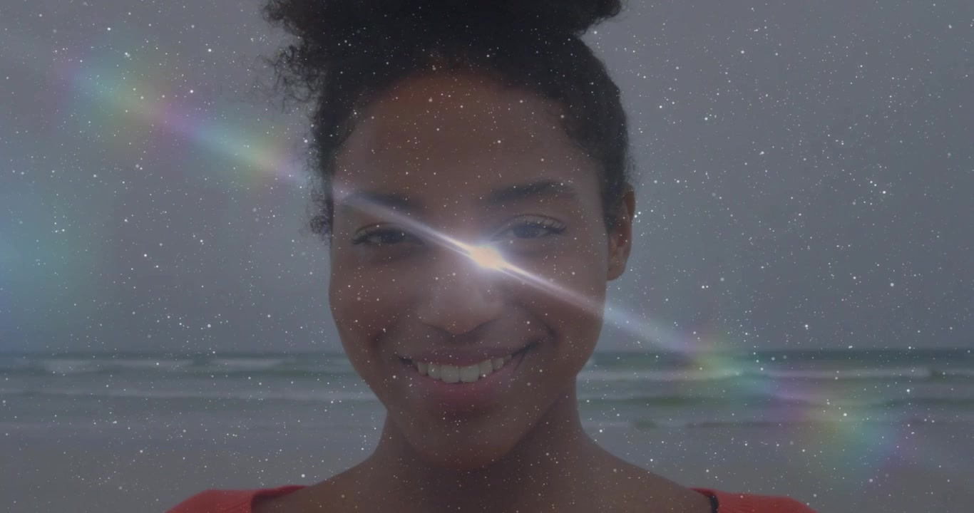 Close-up of Smiling Young Black Woman with Digital Overlay and Lens Flare