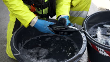 Close-up-of-veterinarian-inspecting-salmon-for-lice-on-fish-farm