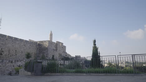 iconic tower of david in jerusalem, set against a serene blue sky with soft clouds