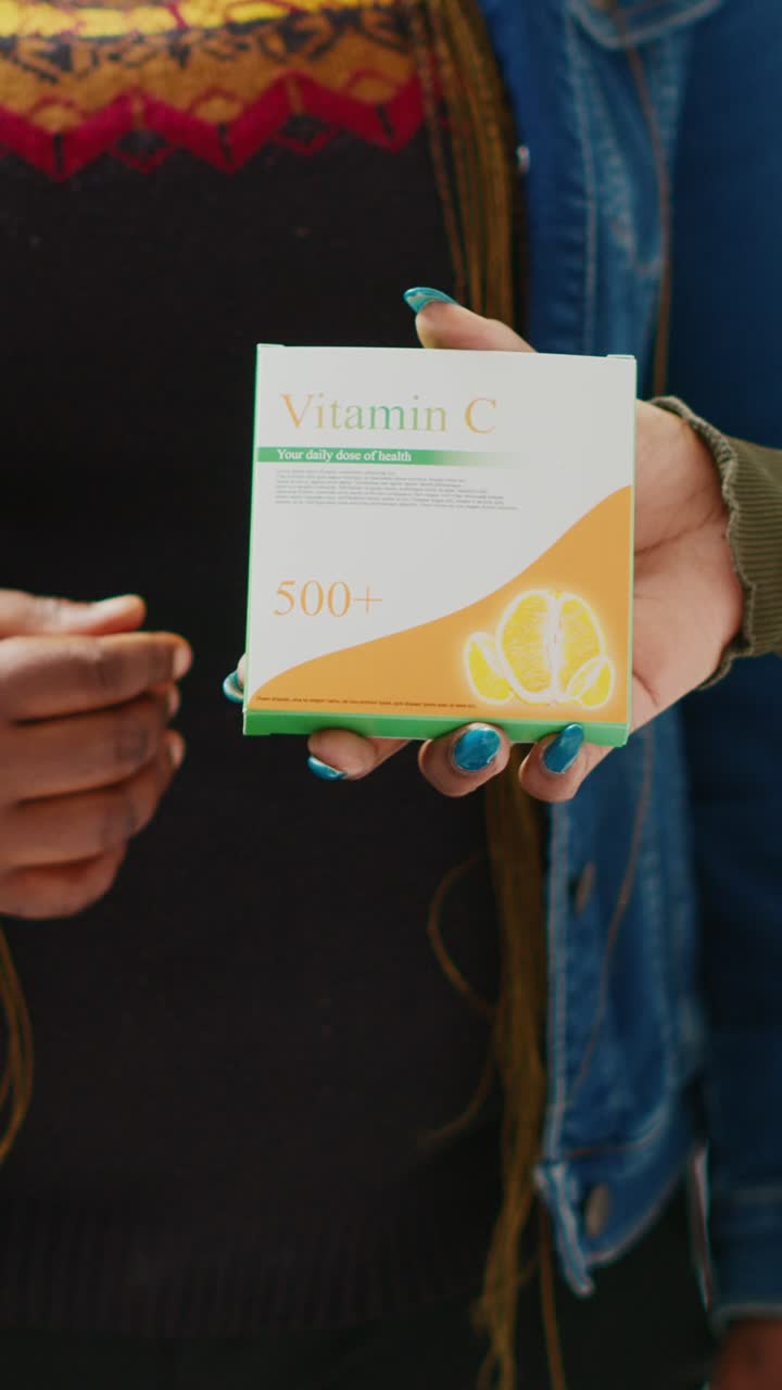 Vertical video: Health specialist recommending box of drugs to client