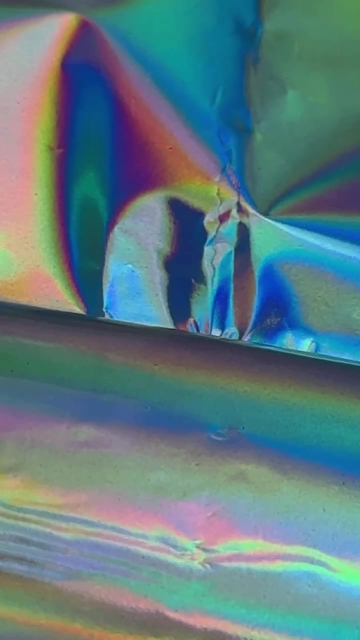 Superficie in Lamina Olografica Astratta con Colori Iridescenti Cangianti