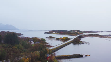 famous atlantic ocean road on a foggy day with island in more og romsdal, norway