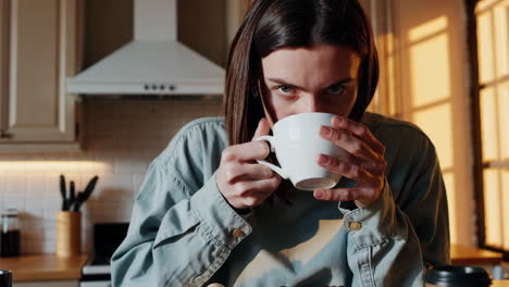 woman enjoying a cup of coffee in the morning