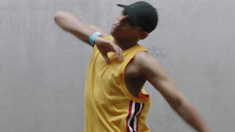 dancing-man-young-happy-street-dancer-performing-various-freestyle-dance-moves-fit-mixed-race-male-practicing-in-grungy-warehouse-wearing-yellow-vest-close-up