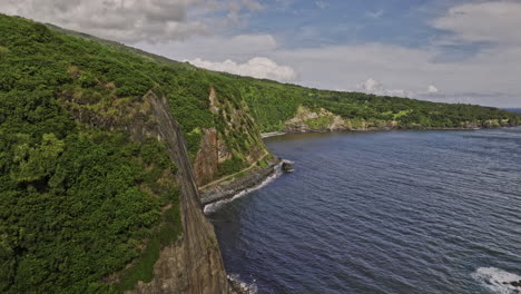 maui hawaii aerial v49 flyover coastline along hana highway capturing black sand beach, rugged lava rock formation, coastal cliffs and lush tropical vegetation - shot with mavic 3 cine - december 2022