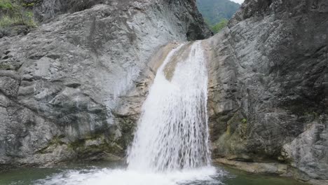 aerial view backwards away from the las yayitas waterfall, peravia, dominican republic