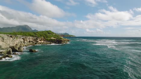 Dramatic-Aerial-Dolly-moving-fast-along-shipwreck-beach,-Hawaii-USA