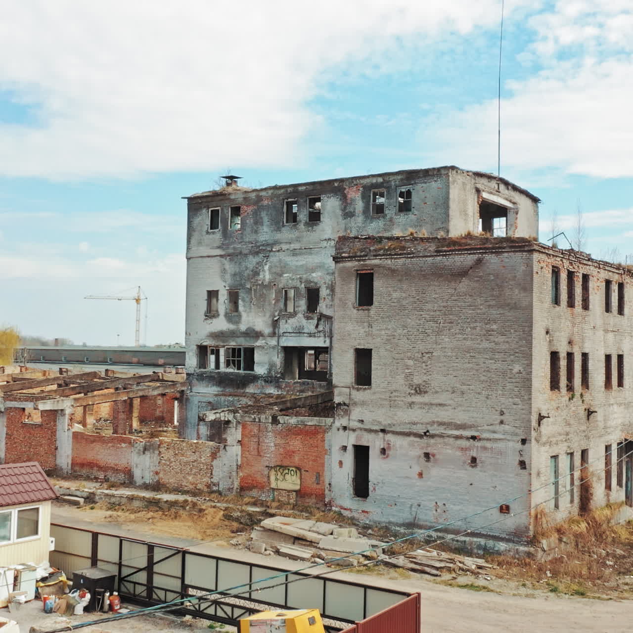 Abandoned building. Aerial view of an old factory ruin and broken windows.