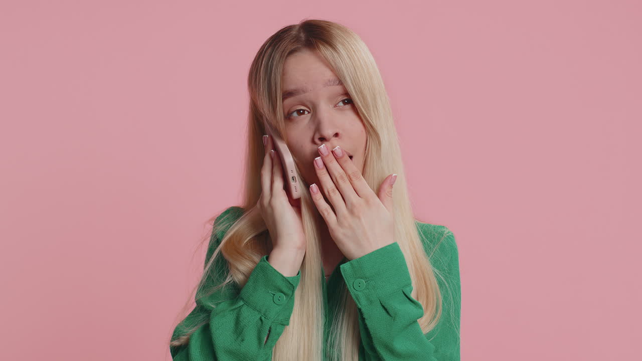Tired sleepy young caucasian woman having annoyed boring talk on smartphone with friend conversation