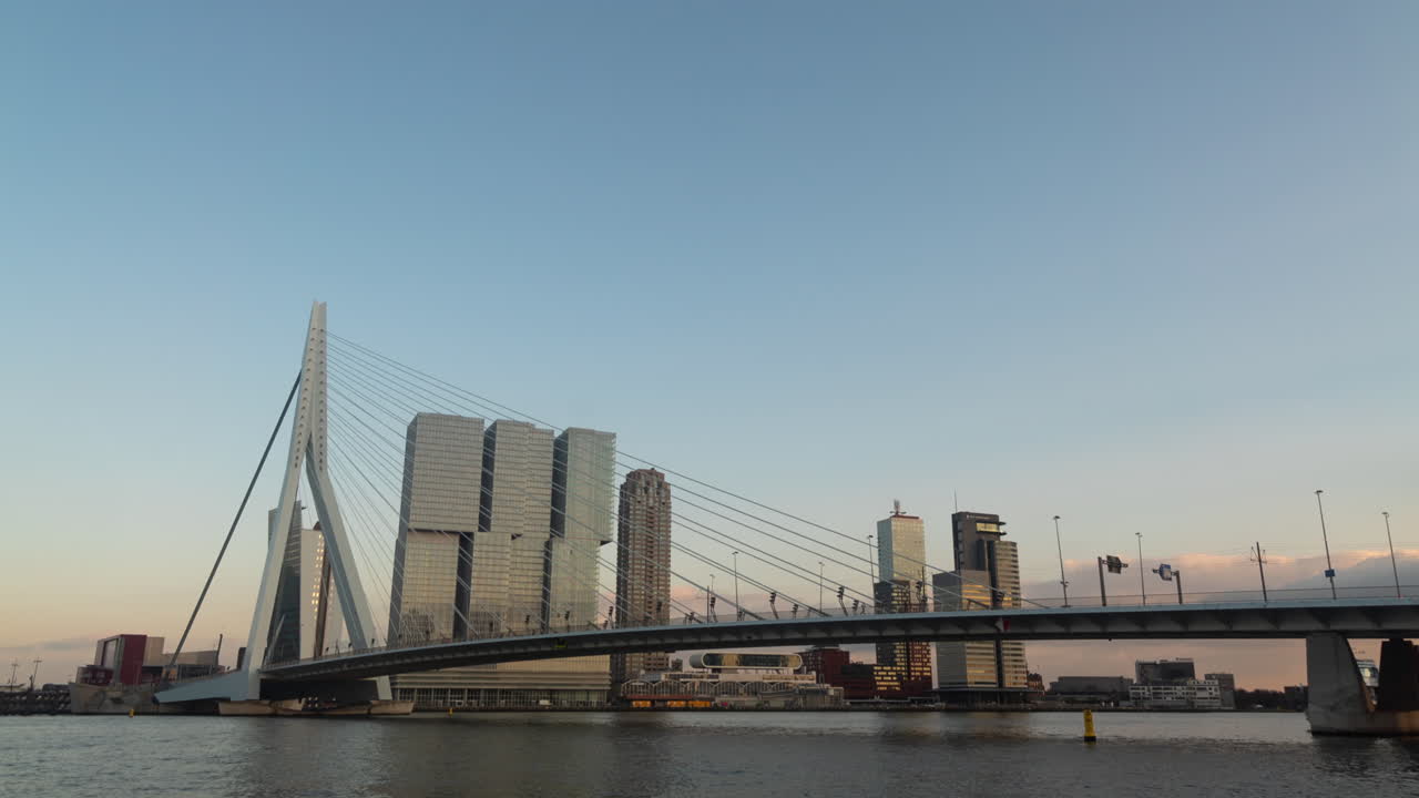 Cable-Stayed Bridge over a River in Amsterdam Cityscape at Sunset