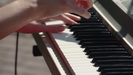 pianist plays the synthesizer as part of the band