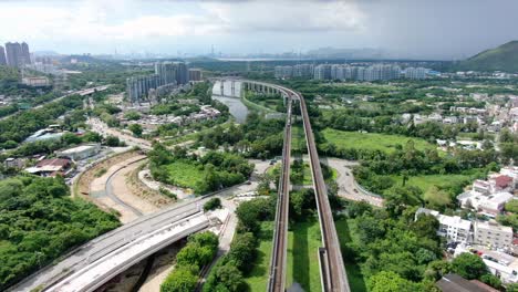 hong kong mtr railroad in the city outskirts, aerial view