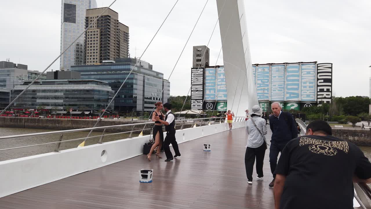 Tourists sightseeing Tango Argentine Dancers at Puerto Madero POV