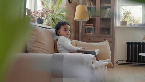 cute toddler with book